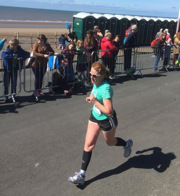 Pam running at a finish